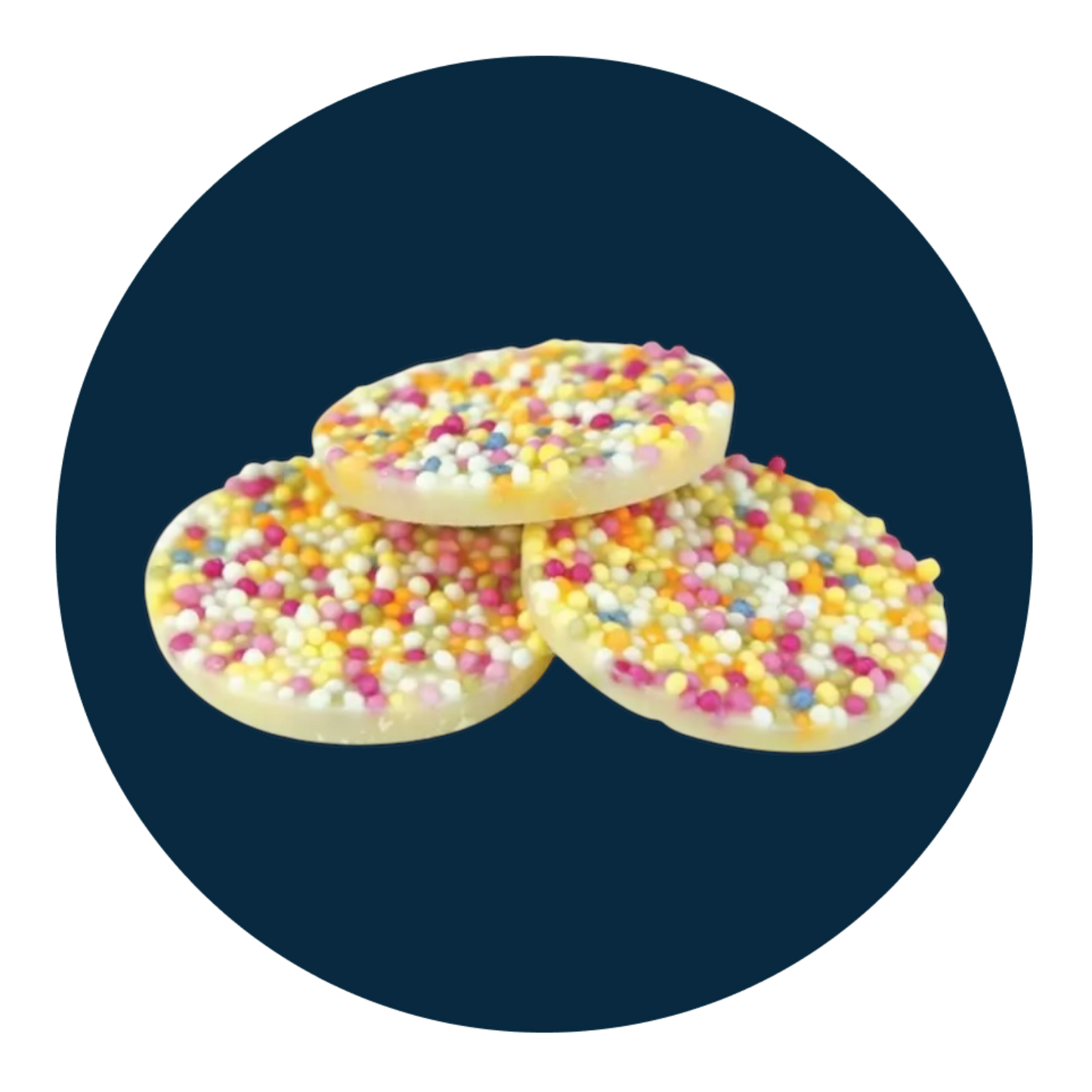 Large white chocolate discs with colourful sprinkles on top