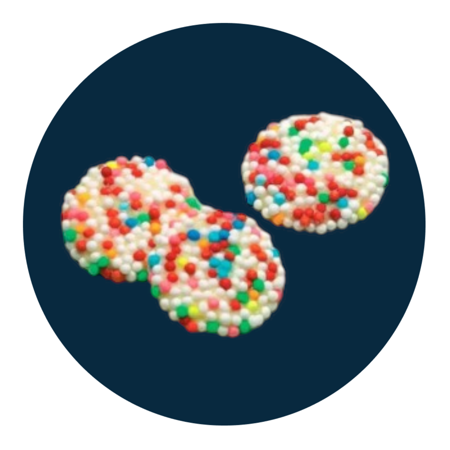 White chocolate discs topped with colourful sprinkles